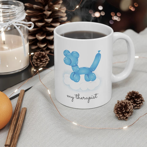 White mug with an blue balloon dog illustration and the text 'my therapist.'