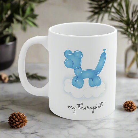 White mug featuring an blue balloon dog on a cloud with the text 'my therapist.'