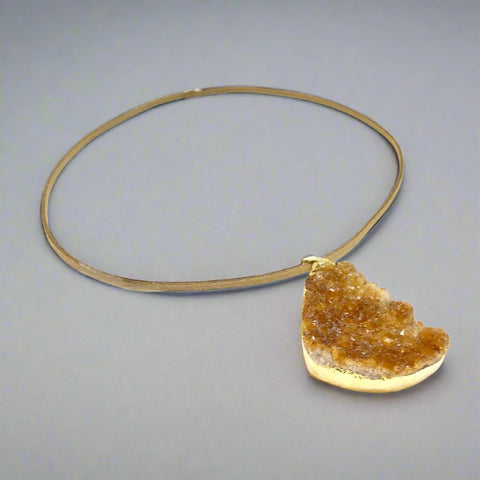 "Orange citrine pendant on a leather cord"