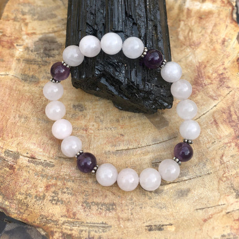 Rose Quartz and Amethyst bracelet on a natural background.